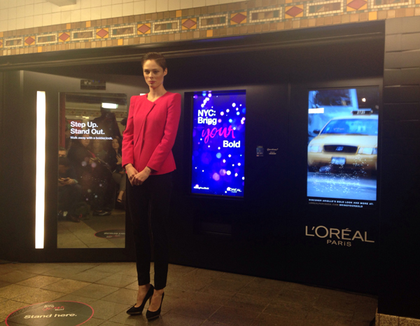 Coco Rocha dgives us a demonstration of the new Intelligent Color Experience at the ribbon cutting ceremony.
